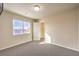 Carpeted bedroom has a view from the window and access to closet at 5490 Tulip Hill Ave, Las Vegas, NV 89141