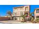 Charming two-story home with a three car garage, balcony and brick driveway at 5490 Tulip Hill Ave, Las Vegas, NV 89141