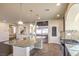 Spacious kitchen featuring a large island with granite countertops and stainless steel appliances at 5490 Tulip Hill Ave, Las Vegas, NV 89141