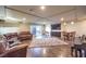 Spacious living room with recessed lighting, fireplace, hardwood floors, and sliding door to the backyard at 5490 Tulip Hill Ave, Las Vegas, NV 89141