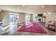 Spacious living room featuring fireplace, hardwood floors, and natural light at 5490 Tulip Hill Ave, Las Vegas, NV 89141