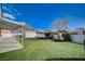 View of the backyard with its custom putting green and the covered patio at 5767 Tabitha Ave, Las Vegas, NV 89156