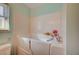 Walk-in bathtub, ideal for individuals with limited mobility, and a tiled wall at 5767 Tabitha Ave, Las Vegas, NV 89156