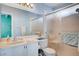 Well-lit bathroom featuring vanity sink and a glass-door shower at 5767 Tabitha Ave, Las Vegas, NV 89156