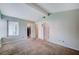 Bright carpeted bedroom with high ceilings and natural light coming through window at 5767 Tabitha Ave, Las Vegas, NV 89156