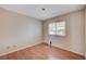 Bedroom with wood floors and a window with a view of the outside at 5767 Tabitha Ave, Las Vegas, NV 89156