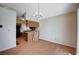 Dining area with wood-look floors and views into the kitchen, perfect for Gathering gatherings and casual dining at 5767 Tabitha Ave, Las Vegas, NV 89156