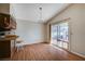 Bright dining area featuring vaulted ceilings, wood floors and a sliding glass door at 5767 Tabitha Ave, Las Vegas, NV 89156