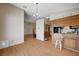 Open-concept dining room with wood floors and a chandelier adjacent to the kitchen at 5767 Tabitha Ave, Las Vegas, NV 89156