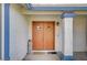 Elegant front door with diamond pane windows, and a pillar that highlights the home's entrance at 5767 Tabitha Ave, Las Vegas, NV 89156