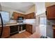 Kitchen featuring wood cabinets and black appliances in an eat-in kitchen area at 5767 Tabitha Ave, Las Vegas, NV 89156