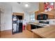 Kitchen featuring wood cabinets, laminate countertops, and black appliances at 5767 Tabitha Ave, Las Vegas, NV 89156