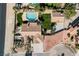 Aerial view of single story home with pool and landscaped yard at 5840 N El Capitan Way, Las Vegas, NV 89149