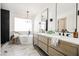 Elegant bathroom with soaking tub, double vanity, and marble flooring at 5840 N El Capitan Way, Las Vegas, NV 89149