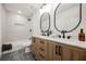 Modern bathroom with double vanity, subway tile, and updated fixtures at 5840 N El Capitan Way, Las Vegas, NV 89149