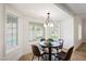 Breakfast nook with a round table and chairs, overlooking the backyard at 5840 N El Capitan Way, Las Vegas, NV 89149