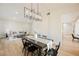 Elegant dining area with a rustic farmhouse table and black chairs at 5840 N El Capitan Way, Las Vegas, NV 89149