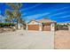 House exterior with two-car garage and driveway at 5840 N El Capitan Way, Las Vegas, NV 89149