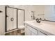 Stylish bathroom featuring a walk-in shower with a glass door, a single sink vanity, and modern finishes at 65 Ibiza Lake Dr, Henderson, NV 89011