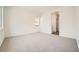 Spacious bedroom with plush carpet, and a view to a hallway at 65 Ibiza Lake Dr, Henderson, NV 89011