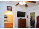 Bedroom with large closet and mounted TV at 7566 Luna Del Rey St, Las Vegas, NV 89123