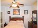 Comfortable bedroom with ceiling fan and ensuite bathroom access at 7566 Luna Del Rey St, Las Vegas, NV 89123