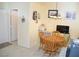 Dining area with wood table and chairs near entryway at 7566 Luna Del Rey St, Las Vegas, NV 89123