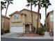 Two-story house with attached garage and landscaping at 7566 Luna Del Rey St, Las Vegas, NV 89123