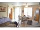 Living room with light colored couches and wood floors at 7566 Luna Del Rey St, Las Vegas, NV 89123