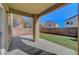 View of the backyard with a covered patio, green lawn, and block wall providing privacy at 8040 Marshall Canyon Dr, Las Vegas, NV 89166