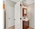 Bathroom with a stylish vanity, sink, and wooden framed mirror at 8040 Marshall Canyon Dr, Las Vegas, NV 89166