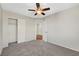 Bedroom features neutral walls, ceiling fan, carpet, and closet at 8040 Marshall Canyon Dr, Las Vegas, NV 89166