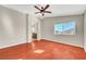 Large bedroom featuring a ceiling fan, vaulted ceiling and a view into the primary bathroom at 8040 Marshall Canyon Dr, Las Vegas, NV 89166