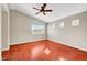 Spacious bedroom featuring hardwood floors, ceiling fan and vaulted ceiling at 8040 Marshall Canyon Dr, Las Vegas, NV 89166