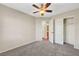 Bedroom features neutral walls, a ceiling fan, carpet, and a closet at 8040 Marshall Canyon Dr, Las Vegas, NV 89166