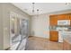 Dining area with tile floors, direct access to the patio, and views of the kitchen's breakfast bar at 8040 Marshall Canyon Dr, Las Vegas, NV 89166