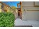 A cozy front entrance featuring a gated courtyard that leads to a charming red front door at 8040 Marshall Canyon Dr, Las Vegas, NV 89166