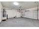 Spacious garage with a garage door and water heater at 8040 Marshall Canyon Dr, Las Vegas, NV 89166