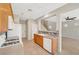 Spacious kitchen with adjacent living area, featuring modern appliances and tiled flooring at 8040 Marshall Canyon Dr, Las Vegas, NV 89166