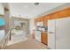 Well-lit kitchen with stainless steel appliances and a view of the backyard through sliding glass doors at 8040 Marshall Canyon Dr, Las Vegas, NV 89166