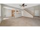 Open-concept living area with tile flooring, ceiling fan, and a view into the adjacent kitchen area at 8040 Marshall Canyon Dr, Las Vegas, NV 89166