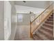 Bright living room showcasing a staircase, tile flooring, and plenty of natural light from large windows at 8040 Marshall Canyon Dr, Las Vegas, NV 89166