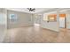 Spacious living room with tile floors, a ceiling fan, and an open layout connected to the kitchen at 8040 Marshall Canyon Dr, Las Vegas, NV 89166