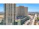 Highrise condo building with parking garage and surrounding landscape at 8255 Las Vegas Blvd # 1505, Las Vegas, NV 89123