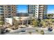 Luxury highrise condo building entrance with landscaping and signage at 8255 Las Vegas Blvd # 1505, Las Vegas, NV 89123