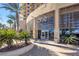 Modern building exterior with palm trees and landscaping at 8255 Las Vegas Blvd # 1505, Las Vegas, NV 89123