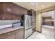 Compact kitchenette with refrigerator, oven, and ample storage at 8255 Las Vegas Blvd # 1505, Las Vegas, NV 89123