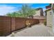 Landscaped backyard with brick wall and fountain at 8261 Peaceful Mountain Ave, Las Vegas, NV 89178