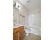 Well-lit bathroom featuring a tub, toilet and wooden vanity at 8261 Peaceful Mountain Ave, Las Vegas, NV 89178