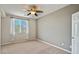 Well-lit bedroom with ceiling fan and window at 8261 Peaceful Mountain Ave, Las Vegas, NV 89178